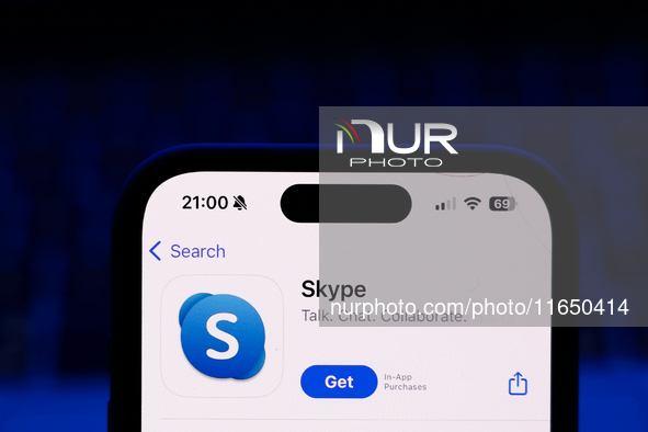 A laptop keyboard and Skype on App Store displayed on a phone screen are seen in this illustration photo taken in Poland on October 8, 2024....