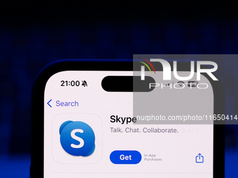 A laptop keyboard and Skype on App Store displayed on a phone screen are seen in this illustration photo taken in Poland on October 8, 2024....