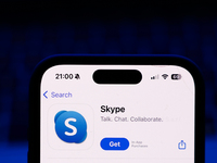 A laptop keyboard and Skype on App Store displayed on a phone screen are seen in this illustration photo taken in Poland on October 8, 2024....