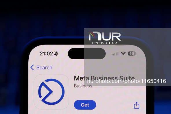 A laptop keyboard and Meta Business Suite on App Store displayed on a phone screen are seen in this illustration photo taken in Poland on Oc...