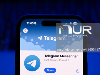 A laptop keyboard and Telegram on App Store displayed on a phone screen are seen in this illustration photo taken in Poland on October 8, 20...