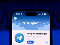 A laptop keyboard and Telegram on App Store displayed on a phone screen are seen in this illustration photo taken in Poland on October 8, 20...