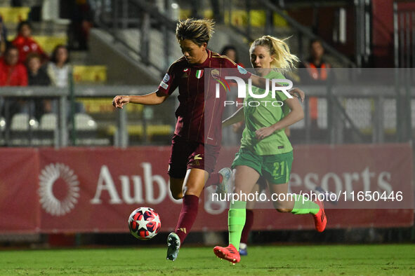 Moeka Minami of A.S. Roma Femminile and Rebecka Blomqvist of VfL Wolfsburg are in action during Group A - Day 1 of the UEFA Women's Champion...