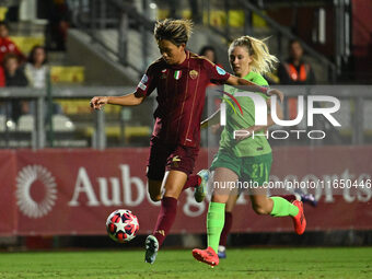 Moeka Minami of A.S. Roma Femminile and Rebecka Blomqvist of VfL Wolfsburg are in action during Group A - Day 1 of the UEFA Women's Champion...