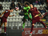 Lucia Di Guglielmo of A.S. Roma Femminile, Lineth Beerensteyn of VfL Wolfsburg, and Elena Linari of A.S. Roma Femminile are in action during...