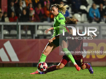 Lena Lattwein of VfL Wolfsburg and Saki Kumagai of A.S. Roma Femminile are in action during Group A - Day 1 of the UEFA Women's Champions Le...