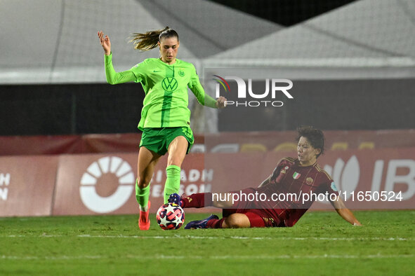 Jule Brand of VfL Wolfsburg and Saki Kumagai of A.S. Roma Femminile are in action during Group A - Day 1 of the UEFA Women's Champions Leagu...