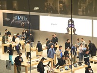 Customers experience Apple products at the Taikoo Li Apple Store in Chengdu, China, on October 8, 2024. (