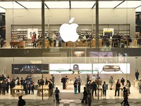 Customers experience Apple products at the Taikoo Li Apple Store in Chengdu, China, on October 8, 2024. (