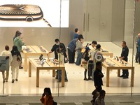 Customers experience Apple products at the Taikoo Li Apple Store in Chengdu, China, on October 8, 2024. (