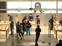 Customers experience Apple products at the Taikoo Li Apple Store in Chengdu, China, on October 8, 2024. (