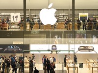 Customers experience Apple products at the Taikoo Li Apple Store in Chengdu, China, on October 8, 2024. (