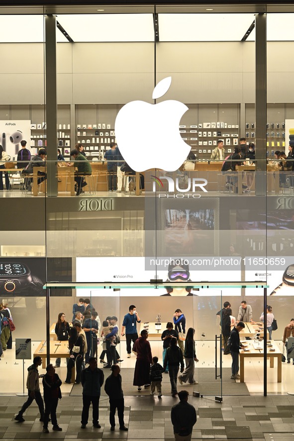 Customers experience Apple products at the Taikoo Li Apple Store in Chengdu, China, on October 8, 2024. 