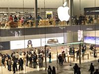 Customers experience Apple products at the Taikoo Li Apple Store in Chengdu, China, on October 8, 2024. (