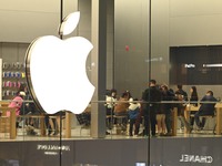 Customers experience Apple products at the Taikoo Li Apple Store in Chengdu, China, on October 8, 2024. (