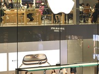 Customers experience Apple products at the Taikoo Li Apple Store in Chengdu, China, on October 8, 2024. (