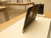 A Huawei Mate XT triple foldable screen mobile phone is displayed at a Huawei store located at IFS International Financial Center on Chunxi...