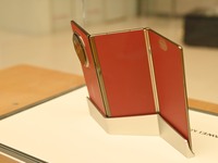 A Huawei Mate XT triple foldable screen mobile phone is displayed at a Huawei store located at IFS International Financial Center on Chunxi...