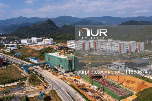 Workers work at the construction site of the 2024 help workshop in Congjiang County, Guizhou Province, China, on October 8, 2024. 