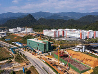 Workers work at the construction site of the 2024 help workshop in Congjiang County, Guizhou Province, China, on October 8, 2024. (