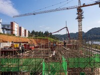 Workers work at the construction site of the 2024 help workshop in Congjiang County, Guizhou Province, China, on October 8, 2024. (