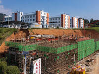 Workers work at the construction site of the 2024 help workshop in Congjiang County, Guizhou Province, China, on October 8, 2024. (