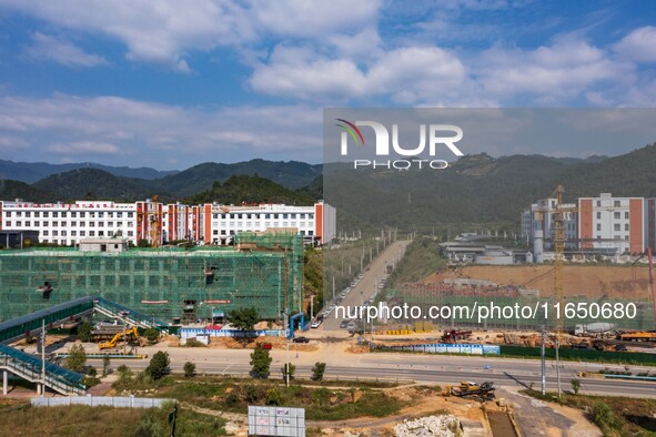 Workers work at the construction site of the 2024 help workshop in Congjiang County, Guizhou Province, China, on October 8, 2024. 