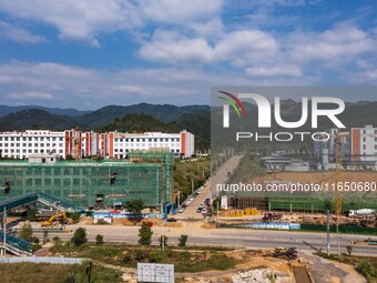 Workers work at the construction site of the 2024 help workshop in Congjiang County, Guizhou Province, China, on October 8, 2024. (