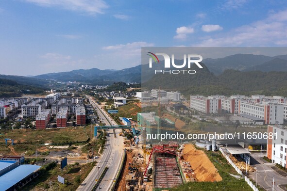 Workers work at the construction site of the 2024 help workshop in Congjiang County, Guizhou Province, China, on October 8, 2024. 