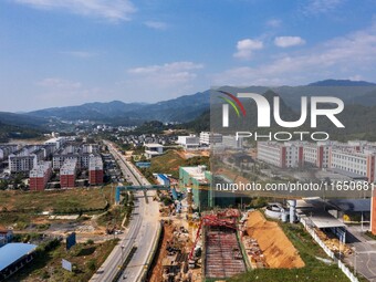 Workers work at the construction site of the 2024 help workshop in Congjiang County, Guizhou Province, China, on October 8, 2024. (