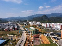 Workers work at the construction site of the 2024 help workshop in Congjiang County, Guizhou Province, China, on October 8, 2024. (