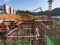 Workers work at the construction site of the 2024 help workshop in Congjiang County, Guizhou Province, China, on October 8, 2024. (