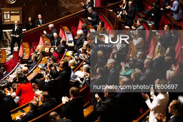 In Paris, France, on October 8, 2024, deputies of the left-wing party applaud Olivier Faure's speech during the debate on the motion of cens...