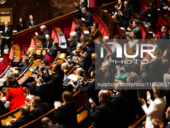 In Paris, France, on October 8, 2024, deputies of the left-wing party applaud Olivier Faure's speech during the debate on the motion of cens...