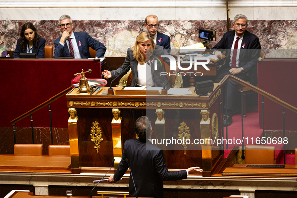 Yael Braun-Pivet, President of the National Assembly, argues with Olivier Faure, deputy of the Socialistes et Apparentes, during the debate...