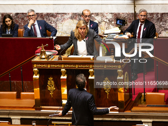 Yael Braun-Pivet, President of the National Assembly, argues with Olivier Faure, deputy of the Socialistes et Apparentes, during the debate...