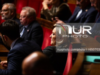 Marine Le Pen, President of the Rassemblement National group, is seen during the debate on the motion of censure of Michel Barnier's governm...