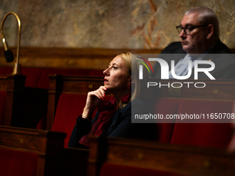 Stephanie Galzy, deputy of the Rassemblement National group, is seen during the debate on the motion of censure of Michel Barnier's governme...