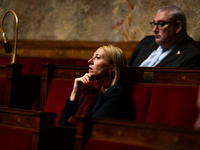 Stephanie Galzy, deputy of the Rassemblement National group, is seen during the debate on the motion of censure of Michel Barnier's governme...