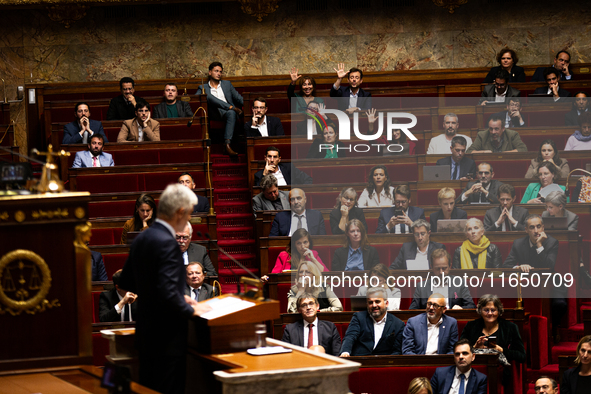 Deputies of the La France Insoumise group react to the speech of Laurent Wauquiez, President of the Droite Republicaine group, during the de...