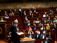 Deputies of the La France Insoumise group react to the speech of Laurent Wauquiez, President of the Droite Republicaine group, during the de...