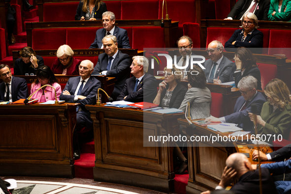 Michel Barnier and ministers are seen during the debate and vote on the motion of censure of his government at the National Assembly in Pari...