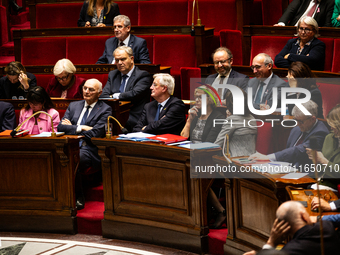 Michel Barnier and ministers are seen during the debate and vote on the motion of censure of his government at the National Assembly in Pari...