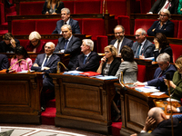 Michel Barnier and ministers are seen during the debate and vote on the motion of censure of his government at the National Assembly in Pari...