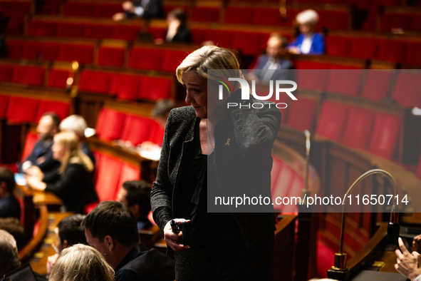 Marine Le Pen, President of the Rassemblement National group, is seen during the debate on the motion of censure of Michel Barnier's governm...