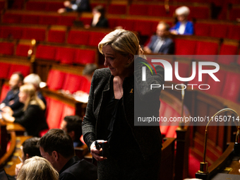 Marine Le Pen, President of the Rassemblement National group, is seen during the debate on the motion of censure of Michel Barnier's governm...