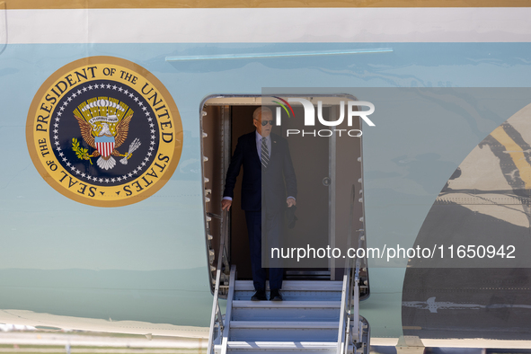 President Joe Biden arrives at General Mitchell International Airport in Milwaukee, Wisconsin, on October 8, 2024. 