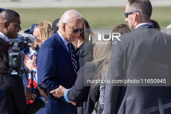 President Joe Biden arrives at General Mitchell International Airport in Milwaukee, Wisconsin, on October 8, 2024. 