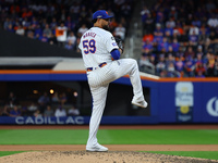 New York Mets starting pitcher Sean Manaea #59 throws during the fifth inning in Game 3 of a baseball NL Division Series against the Philade...