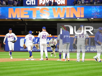 The New York Mets celebrate after their 7-2 win in Game 3 of a baseball NL Division Series against the Philadelphia Phillies at Citi Field i...